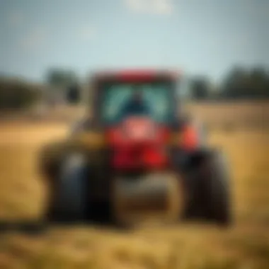 Bale Spear in Action Demonstration of a bale spear in operation with a tractor in a field.