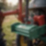 A close-up view of a three point hitch weight box attached to a tractor, showcasing its robust design and functionality