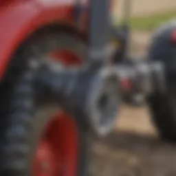 Close-up view of auger drive attachment on tractor