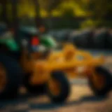 Lawn Tractor with Grader Attachment A lawn tractor equipped with a grader attachment working on a smooth surface