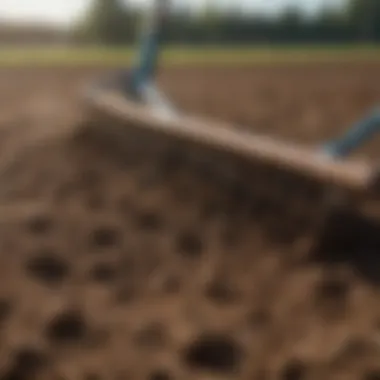 Aerating Soil with a Ballfield Rake Close-up of soil being aerated by a ballfield rake, emphasizing soil quality improvement