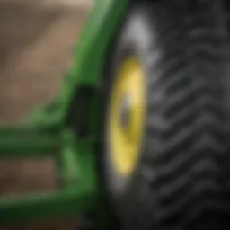 A close-up of the John Deere green mark on agricultural equipment.